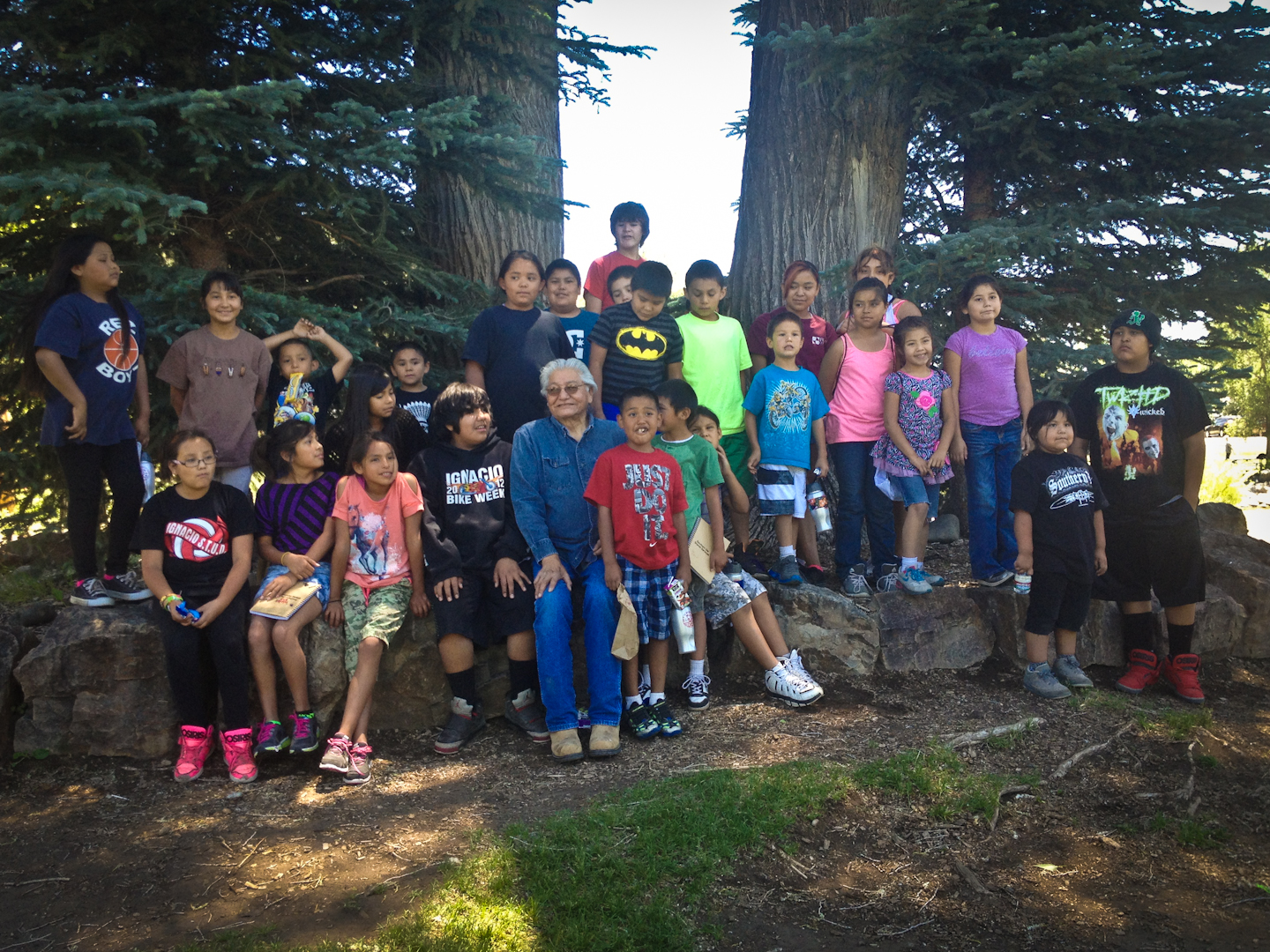 Culture Camp participants stand with Southern Ute elder Alden Naranjo for a group portrait.