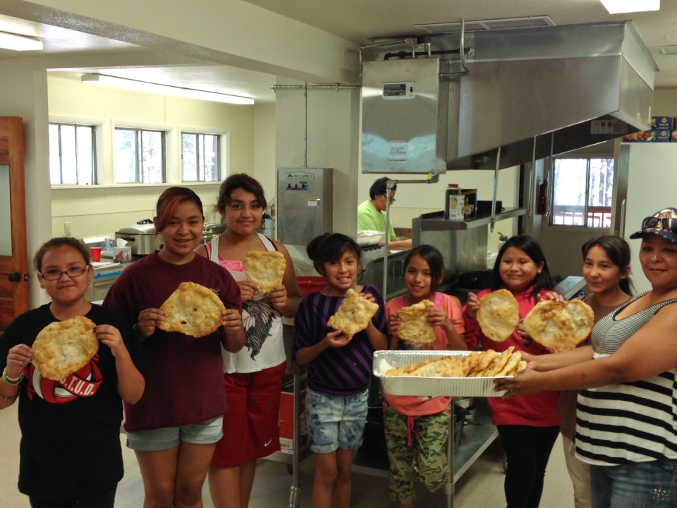 Participants show off their cooking skills by making traditional frybread during one of the many cultural activities.