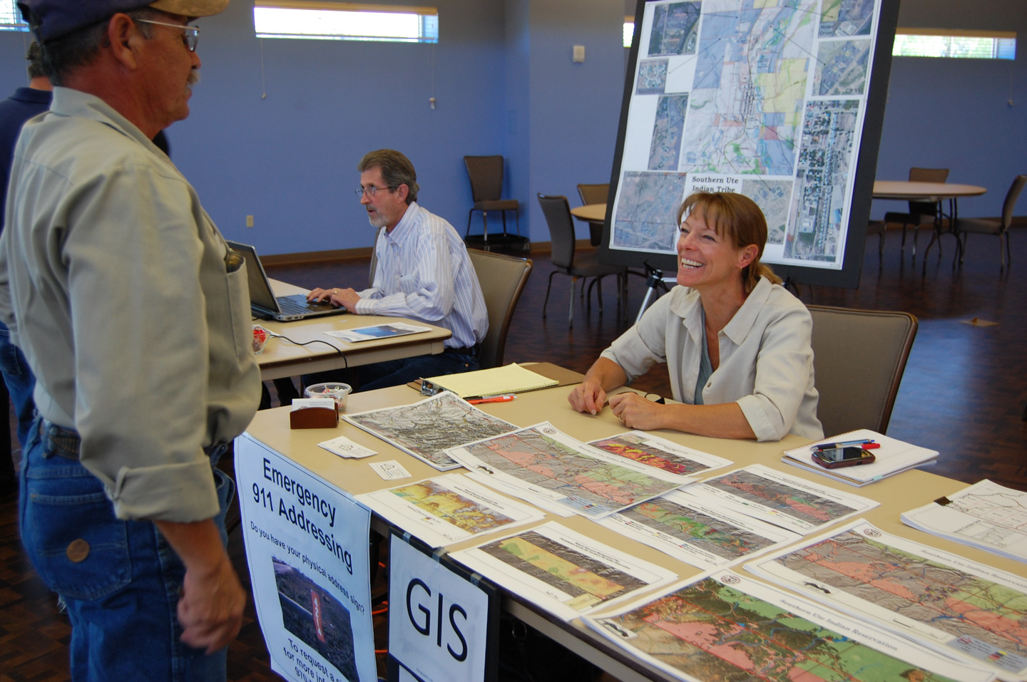 GIS Manager Shelly Riddle discusses her program with a coworker during a Department of Natural Resources Open House