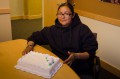 Thumbnail image of GED recipient Dominika Joy celebrates her accomplishment over cake with friends and family on Tuesday, June 18, in the Mouache-Capote Building. Joy is currently working as a summer Youth Employment Worker with the Boys & Girls Club of the Southern Ute Indian Tribe.
