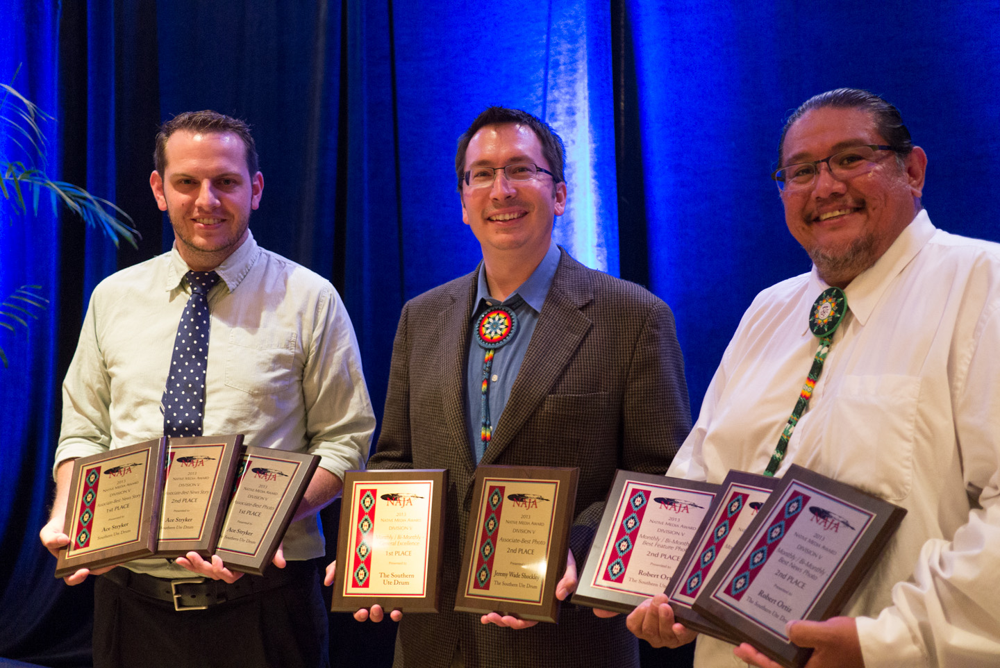 Drum staff members (left to right) Ace Stryker, Jeremy Wade Shockley and Robert L. Ortiz hold the Native American Journalists Association plaques won by the Drum in this year’s Media Awards contest. The awards ceremony took place Saturday, July 20 at the Tempe Mission Palms in Tempe, Ariz.