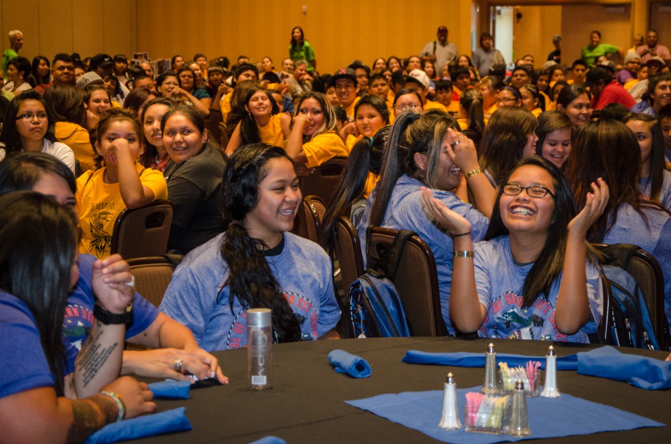 Tri-Ute Games participants (Southern Ute in blue, Ute Mountain Ute in yellow and Northern Ute in red) get reacquainted during this year’s Opening Ceremony on Monday, July 22 at the Sky Ute Casino Resort. The games last took place in Towaoc, Colo., in 2012.