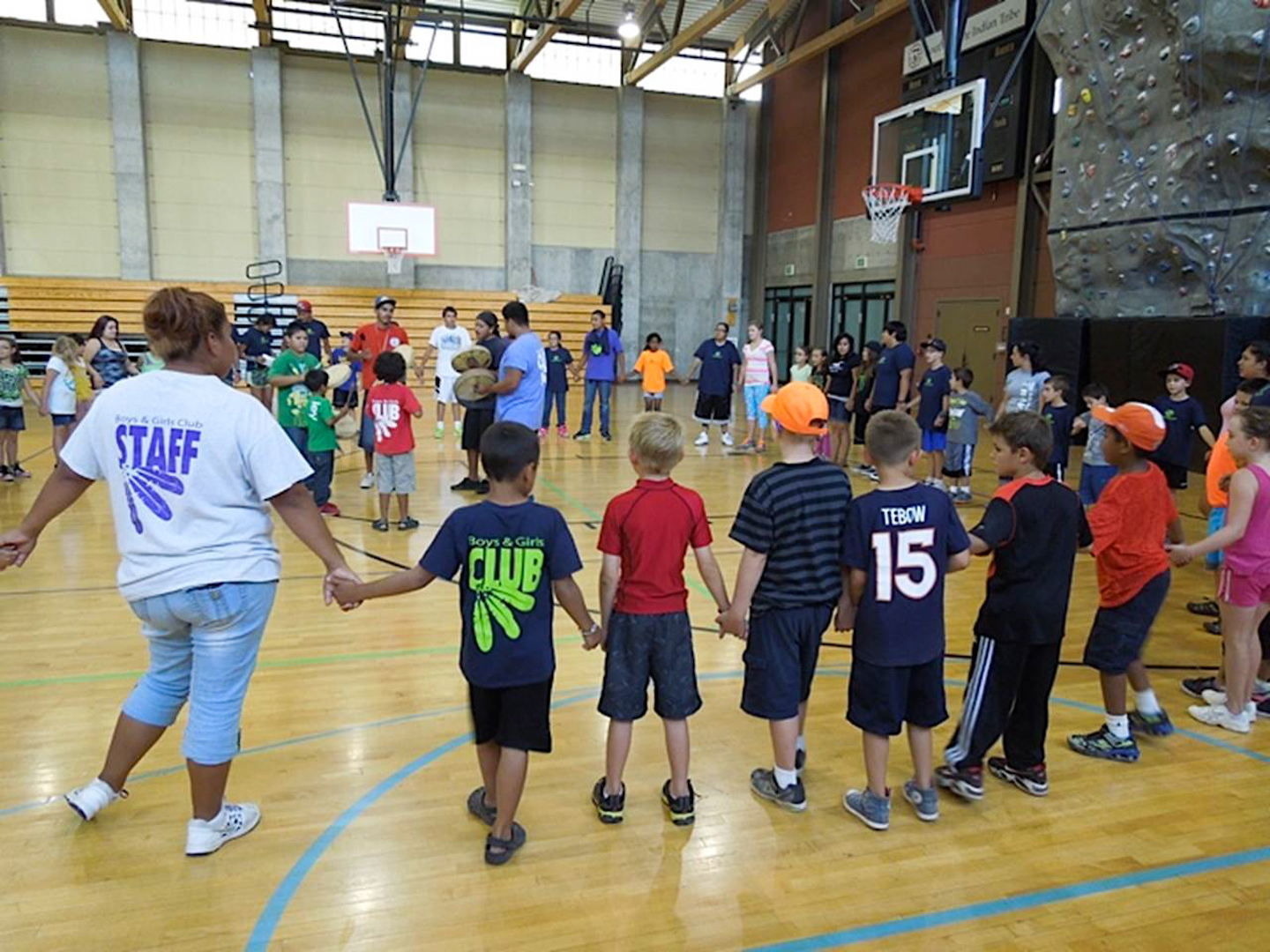 The Boys & Girls Club of the Southern Ute Tribe participated in a round dance as part of the Around the World Theme for Summer Club 2013. Each week, the club highlights a different country or region and focuses on an indigenous culture. Since the Sun Dance is taking place this weekend, the theme is Southern Ute Culture.