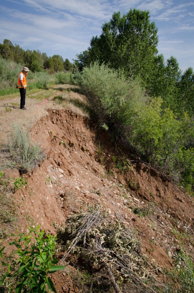 Range Technician Russ Gardner surveys the damage left by a landslide adjacent to the Dr. Morrison Canal northeast of Ignacio between County Road 516 and Buck Highway on Monday, July 8.