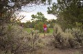 Thumbnail image of A northern Ute golfer lines up for a shot.