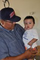 Thumbnail image of Micco Wesley holds son Meskerlwv