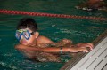 Thumbnail image of A young swimmer sports his swimming gear prior to competition.