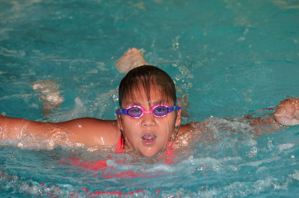 Swimmers display skill during swim competition.