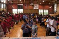 Thumbnail image of Participants from (left to right) the Northern Ute, Southern Ute and Ute Mountain Ute tribes line up inside the SunUte Community Center gym on Wednesday, July 24 to receive a medal and T-shirt.