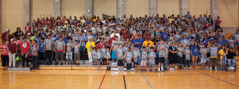 A group of assembled Tri-Ute Games athletes pose for a photo in the SunUte Community Center gym after receiving their medals on Wednesday, July 24.