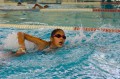 Thumbnail image of A challenger beats through the water at the SunUte Community Center Pool.