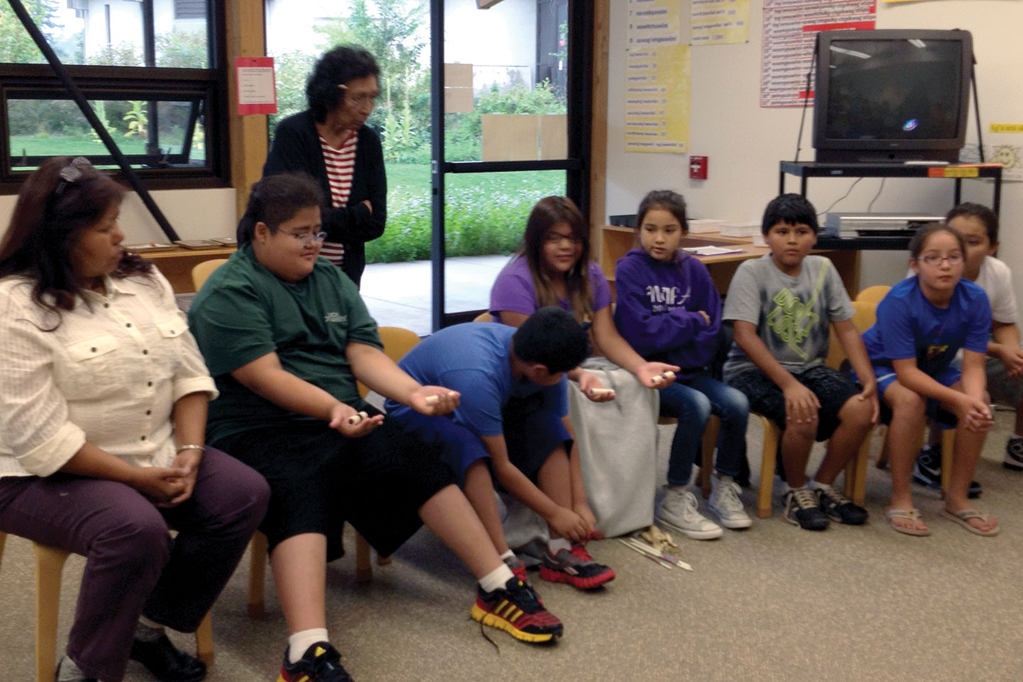 Students practice hand games
