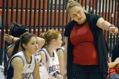 New Ignacio JV coach Dylaina Morelli (replacing Briana Simbeck, now the girls' varsity coach at 3A Bayfield) details a plan to Lady Bobcat Selena Cook during downtime in the team's Tuesday, Dec. 3 season opener inside IHS Gymnasium against 3A Bloomfield, N.M.