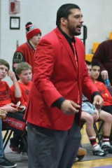 Ignacio High product John Gurule, now the head coach at 4A Durango, shouts instructions to his Demon out on the mat against 3A Bayfield inside BHS Gymnasium on Jan. 30.