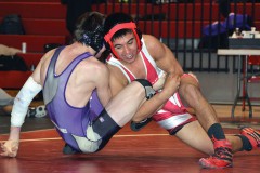 Ignacio 138-pounder Lorenzo Pena tries reining in Bayfield's Colter McMenimen during the teams' non-league dual inside IHS Gymnasium on Friday, Jan. 31. Ignacio downed BHS, 34 to 11, in final preparations for the next day's Butch Melton Invitational.