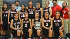 The Ignacio Lady Bobcats present the 2A-District 3 Tournament's second-place plaque to their fans gathered in Cortez on Saturday, March 1. Ignacio lost to Ridgway 50-33 in the finale, but by way of a win over Nucla the previous afternoon, Ignacio still qualified for the Region III Tournament, March 7-8 in Durango at Fort Lewis College.