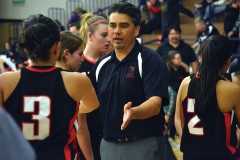 Ignacio head coach Shane Seibel tries keeping the Lady Bobcats, including Gabriela Garcia (3), fired up as halftime of the 2A-Region III Tournament semifinal game versus Paonia in Durango expires.
