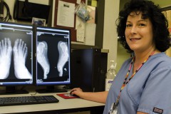 Shanna Rock, Southern Ute Health Center radiology and x-ray technician, demonstrates the new and improved digital x-ray that the clinic has available for patients.