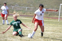 Ignacio's Gabriela Garcia (5) accelerates after gaining possession from Ridgway's Hunter Clapsadl (3), April 12 at IHS Field.