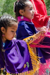 Two young dancers flail their colorful shawls. Hundreds of people gathered May 23-26 for the annual tradition. 