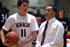 Ignacio head coach Chris Valdez (right) clarifies the plan to senior Clayton Jefferson (11) during halftime of the Bobcats' 'Great Eight' game in Pueblo against Sedgwick County this past season.