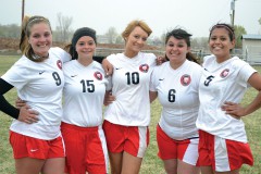 With classmate Roshae Weaver unavailable, the Lady Bobcat soccer seniors who suited up for the team's 2014 home finale – Shannon Mestas (9), Becca Ward (15), Cheyenne Cook (10), Jasmine Red (6), Gabriela Garcia (5) – versus Alamosa on April 26 hold a final smile amidst quickly-dropping temperatures.