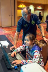 Southern Ute police Department officer, Don Folsom, shares information with a student during the 2014 Health Fair at Sky Ute Casino Resort Friday, Nov. 7.