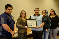The Boys & Girls Club proudly show off their award given by the San Juan Basin Health Department.