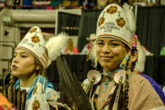 Miss Southern Ute, Ellie Siebel, and Miss Southern Ute Alternate, Autumn Medicine-Blanket, dance with pride and smiles during Grand Entry on Friday, March 20. 