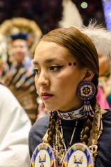 Brianna Goodtracks-Alires marches during the Gathering of Nations’ Grand Entry Ceremony.