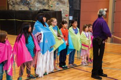 A Bear Dance workshop was hosted at the Sky Ute Casino Event Center on Wednesday, May 6. Bear Dance Chief, Matthew Box, addressed the rules and guidelines for the dance while giving examples of proper etiquette. Box (above) also showed students how to use growlers.