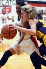 Ignacio's Cortney Wilson-Baker goes for a steal against Bayfield's Tymbree Florian, Jan. 26 inside IHS Gymnasium.