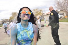 Charlize Valdez gives a colorful smile during the Fun Color Run hosted on Wednesday, April 27 at Ignacio Middle School.