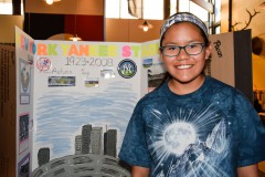Autumn Sage displays her project about the history of New York Yankees Stadium.