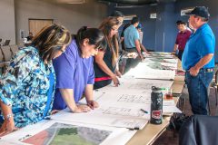 Southern Ute tribal members look over blue prints of what future Cedar Point housing may look like on Thursday, June 2. Tribal members were also asked to write down recommendations and concerns on the blue prints. 
