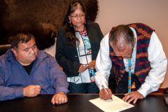 Southern Ute Chairman Clement J. Frost signs a Tri-Ute Council resolution of support for presidential designation of the Bears Ears National Monument, Tuesday, June 14 at Ute Mountain Ute Casino.  Left to right: Ute Indian Tribe Business Committee member, Cummings Vanderhoop and Ute Mountain Ute Vice Chairwoman Juanita Plentyholes. 