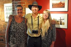 The Shockley family, mother Jan, Jeremy and wife Rachael, pose for a photo during the Artist’s Reception for Jeremy W. Shockley at the Open Shutter for his “The American West” photo exhibit, which will run until Aug. 17.
