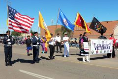 The Southern Ute Veterans Association was part of the Ute Nation Color Guard in the Gallup Inter-Tribal Ceremonial parade, Saturday, Aug. 13 in Gallup, NM. Veterans, (l-r) Willard Light carrying the U.S. flag, Austin Benally carrying the Ute Mountain Ute flag, Darius Richards, Miss Ute Mountain Ute – Talia Whyte, Rudley Weaver carrying the Southern Ute Flag, Howard Richards Sr., Raymond Baker carrying the Southern Ute Veterans Association flag, and Gary Nicholas carrying the Vietnam veterans insignia flag.