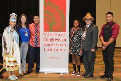 Sunshine Cloud Smith Youth Advisory Council at the Youth Honoring Luncheon on Tuesday, Oct. 11 pose with Miss Indian World, Danielle Ta’ Sheena Finn a member of the Standing Rock Sioux Tribe and NCAI President, Brian Cladoosby.