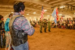 American Youth Bull Riders pay their respects to the color guard represented by Bruce LeClaire, Rudley Weaver, and Bruce Heller from the Southern Ute Veterans Association. 