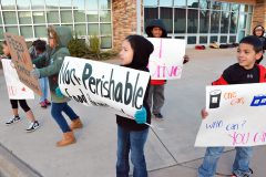 On Thursday, Nov. 17 kids from the Boys and Girls Club of the Southern Ute Indian Tribe held donation signs outside of the Ignacio Community Library.