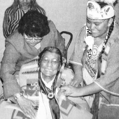 Many Moons Ago - 10 Years Ago: Councilwoman Ramona Eagle and Miss Southern Ute Jalisa Paul, present Essie Kent with a blanket at the Annual Southern Ute Thanksgiving Dinner. Published in the November 22, 2006 issue of the Drum.