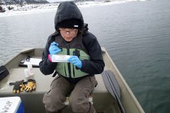 Southern Ute Environmental Program Division Water Quality Technician, Delilah Dougi performs monitoring on Lake Capote.