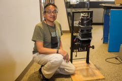 Southern Ute tribal member Robert Baker next to a vintage Beseler negative enlarger on Monday, March 13. The film enlarger is just one of the items awarded in The Southern Ute Drum ‘Darkroom Equipment’ raffle, which Baker won. Baker is a former employee of The Southern Ute Drum newspaper and still works with traditional film processes in his art and photography.