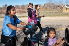 Young participants keep each other company on the first wellness walk of the season in Ignacio, Colo. Participants started at Ute Park and made a circuit through Tribal Campus under blue spring skies. 