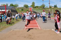 Aubree Lucero leaps with all her might, trying to get the longest jump in her class during the IES field day, held Monday, May 23 at Ignacio High School’s athletic field.