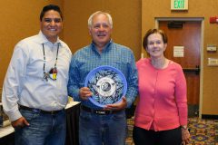 Ken Charles of the Colorado Dept. Of Local Affairs was honored for his 22 years of service to the Commission, standing alongside CCIA Executive Director Ernest House, Jr. and Colorado Lt. Governor Donna Lynne.