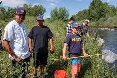 Participants of the Environmental Leadership and Knowledge Seminar stand ready with fishing nets on the Pine River — working alongside of the Southern Ute Wildlife Division, the students captured small fish and other aquatic critters as part of an electrofishing demonstration on Tuesday, June 20. 