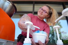 Entrepreneur Jerrika Rarick busy at work ‘making it snow’ while selling snow cones at the SunUte Community Center on Thursday, June 29. 