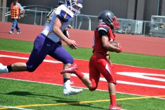 Beating Ellicott’s Kyle Ager (72) to the corner, Ignacio freshman Lawrence Toledo carries in a go-ahead two-point conversion following IHS’ first touchdown in their August 26 season-opener.